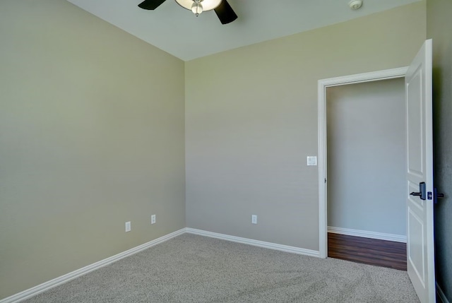 carpeted empty room with ceiling fan