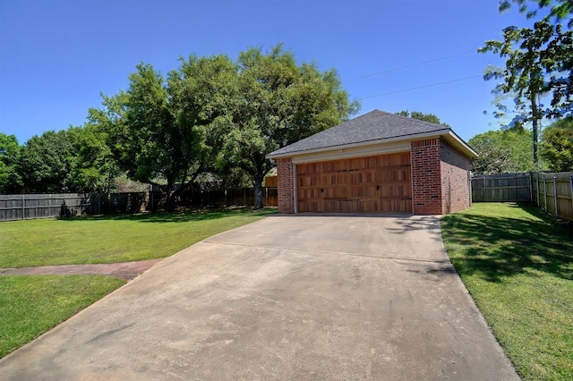 garage featuring a yard