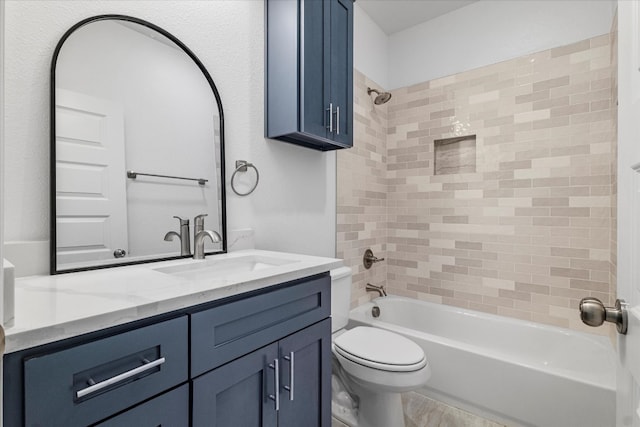 full bathroom with vanity, toilet, and tiled shower / bath