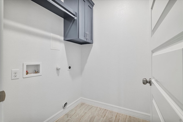 laundry area featuring cabinets, light wood-type flooring, gas dryer hookup, hookup for a washing machine, and electric dryer hookup