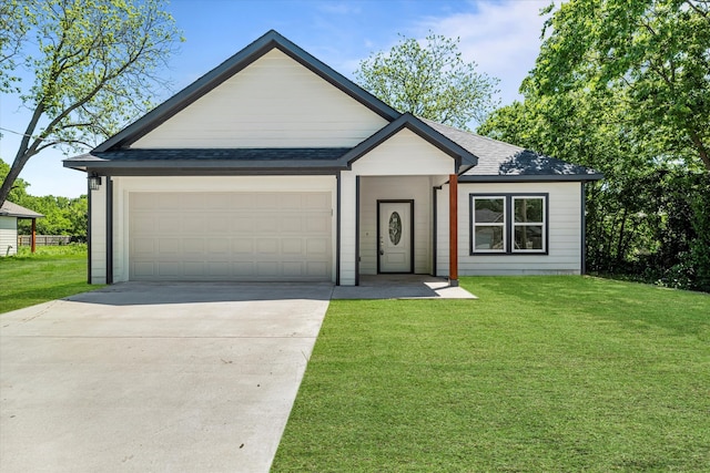 view of front facade featuring a garage and a front lawn