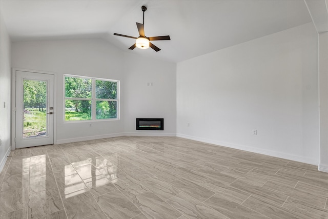 unfurnished living room with ceiling fan and vaulted ceiling