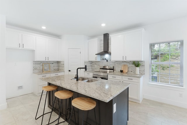 kitchen with sink, wall chimney range hood, white cabinetry, and stainless steel electric range oven