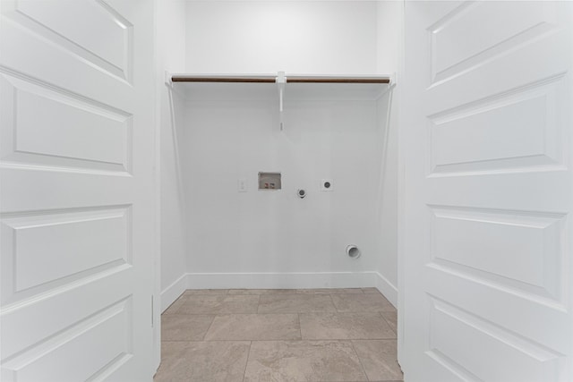 clothes washing area featuring hookup for an electric dryer, light tile flooring, gas dryer hookup, and washer hookup