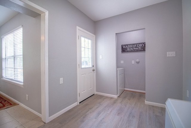 entryway featuring washer / clothes dryer and light wood-type flooring