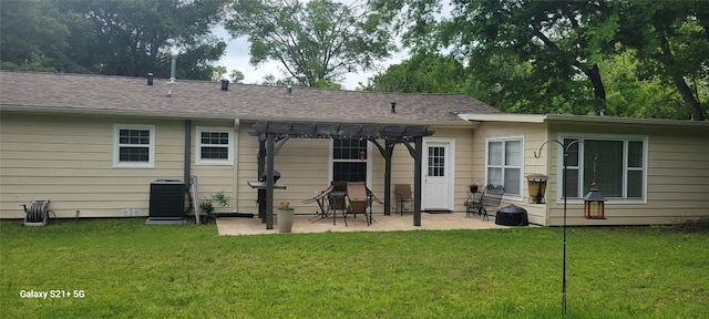 rear view of house featuring a patio, a pergola, a lawn, and central air condition unit