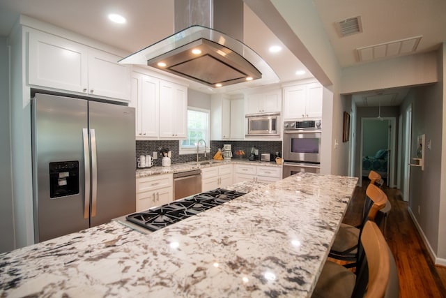 kitchen with backsplash, dark hardwood / wood-style floors, stainless steel appliances, and white cabinetry