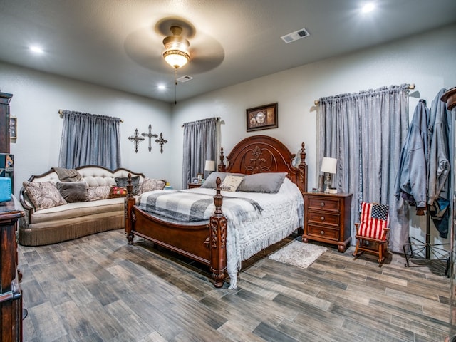 bedroom with ceiling fan and hardwood / wood-style flooring