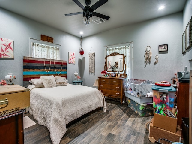 bedroom with wood-type flooring and ceiling fan