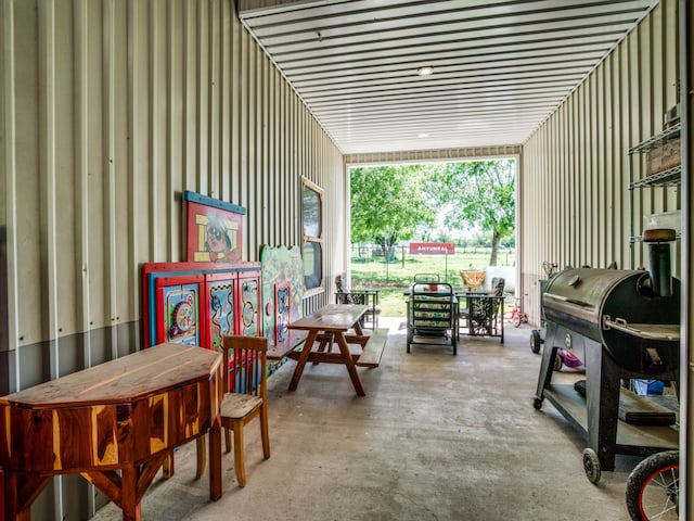 living area with concrete flooring