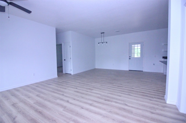 unfurnished room with ceiling fan and light hardwood / wood-style flooring