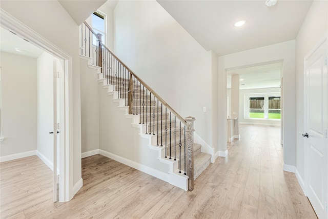 stairway featuring wood-type flooring