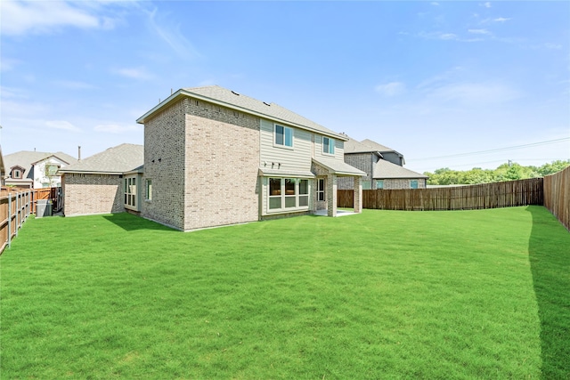 back of house featuring a lawn