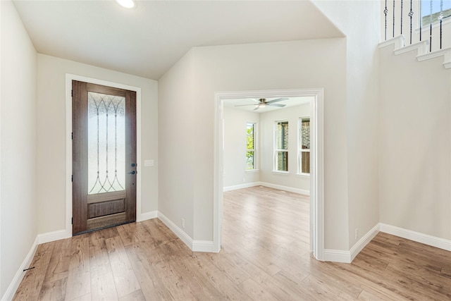 foyer entrance featuring ceiling fan and light hardwood / wood-style floors