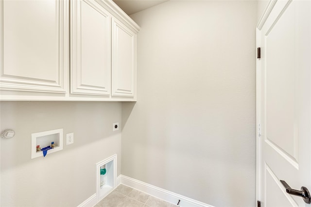 laundry area featuring light tile patterned floors, cabinets, hookup for a washing machine, and hookup for an electric dryer