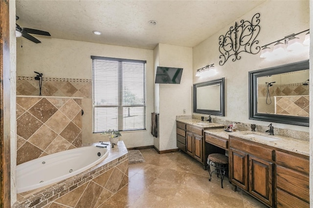 bathroom with ceiling fan, tile floors, dual vanity, and tiled tub