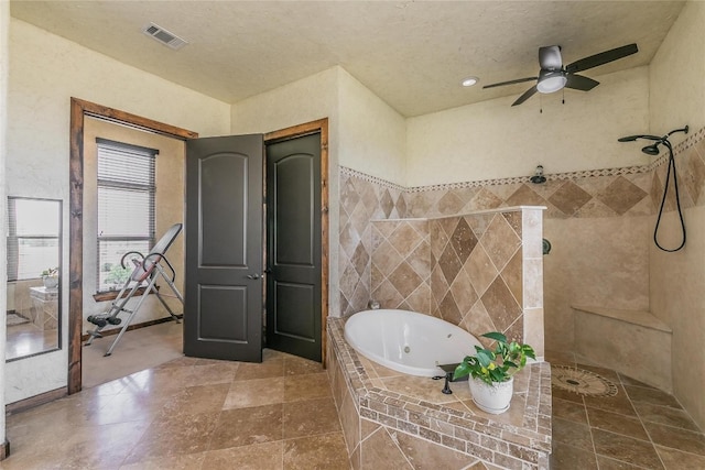 bathroom with tile floors, ceiling fan, and plus walk in shower