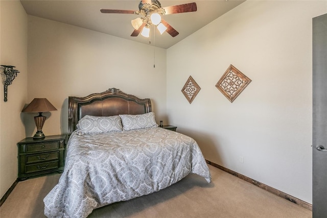 carpeted bedroom with ceiling fan and lofted ceiling