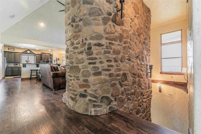 interior space with high vaulted ceiling and dark hardwood / wood-style floors