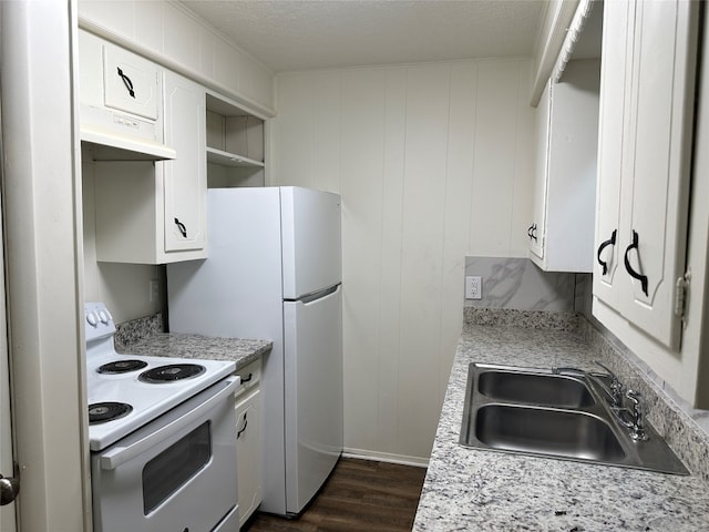 kitchen with white cabinets, dark hardwood / wood-style flooring, sink, white electric range, and a textured ceiling