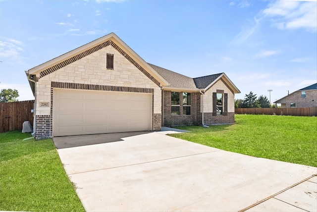 ranch-style house with a garage and a front lawn