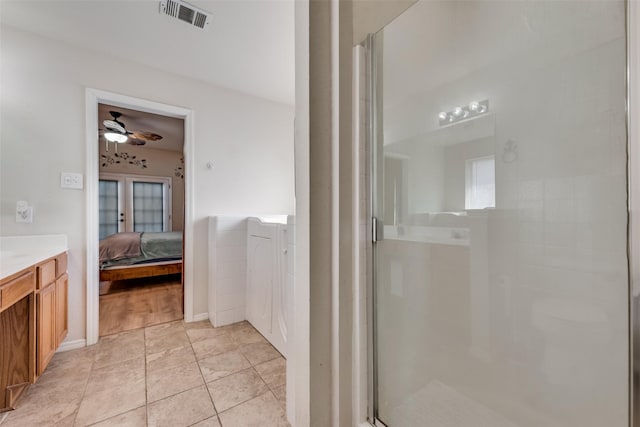 ensuite bathroom featuring ensuite bathroom, a stall shower, vanity, and visible vents