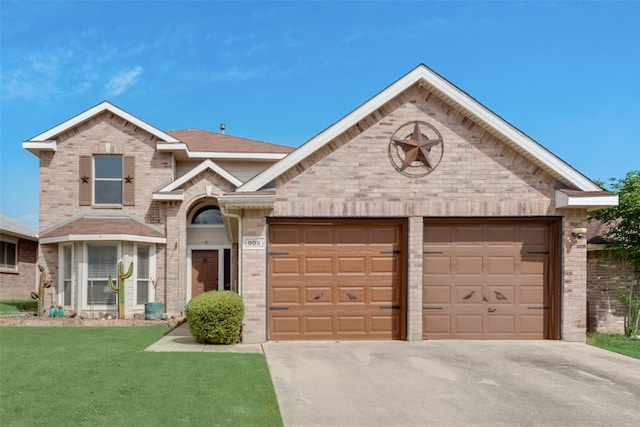 view of front of property featuring a garage and a front lawn