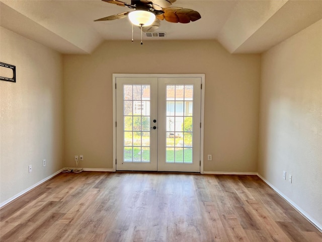 doorway featuring vaulted ceiling, french doors, wood finished floors, and visible vents