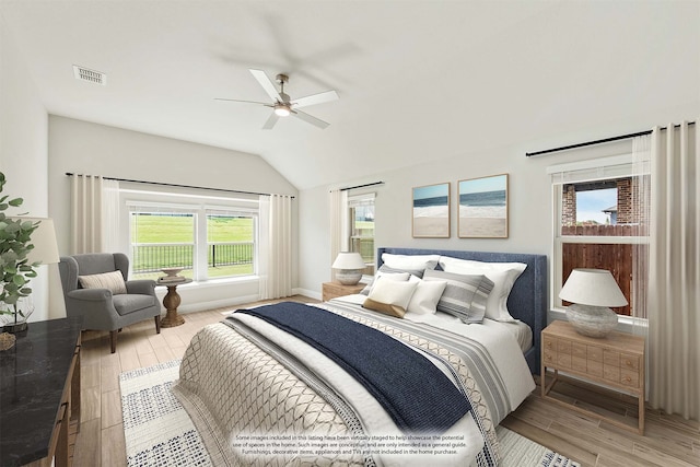 bedroom featuring vaulted ceiling, light hardwood / wood-style flooring, and ceiling fan