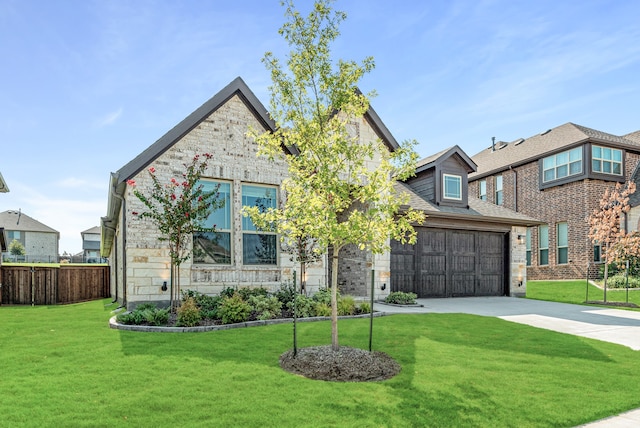 view of front of property with a garage and a front yard