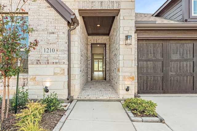 doorway to property featuring a garage