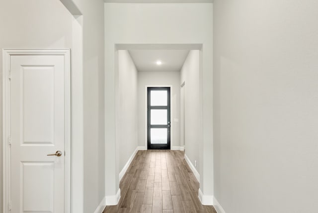 doorway to outside featuring wood-type flooring