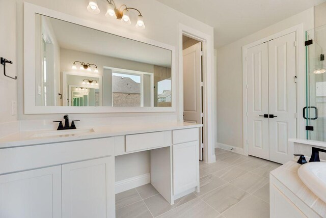 bathroom with vanity, tile patterned flooring, and plus walk in shower