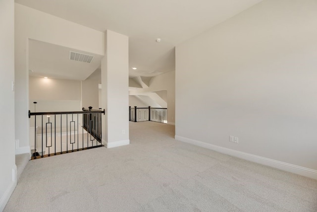 spare room with recessed lighting, visible vents, baseboards, and carpet flooring