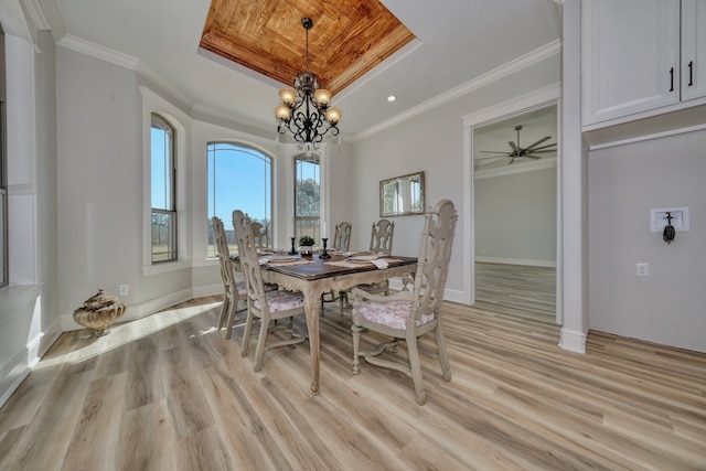 dining space featuring crown molding and light wood-type flooring