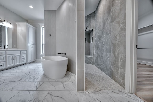 bathroom featuring vanity and shower with separate bathtub