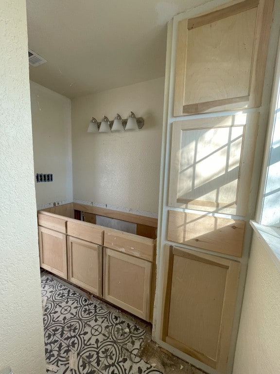 bathroom with tile flooring