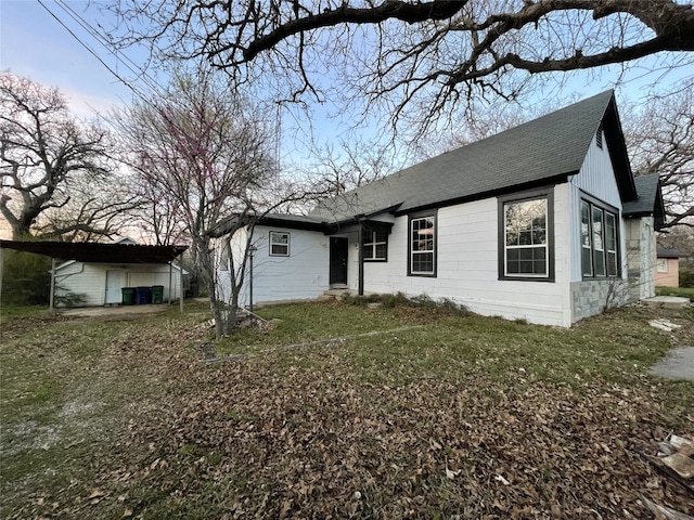 rear view of house with a yard