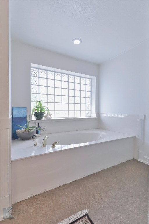 bathroom with a bath to relax in