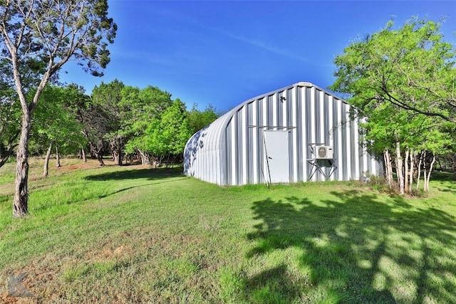 view of shed / structure featuring a yard