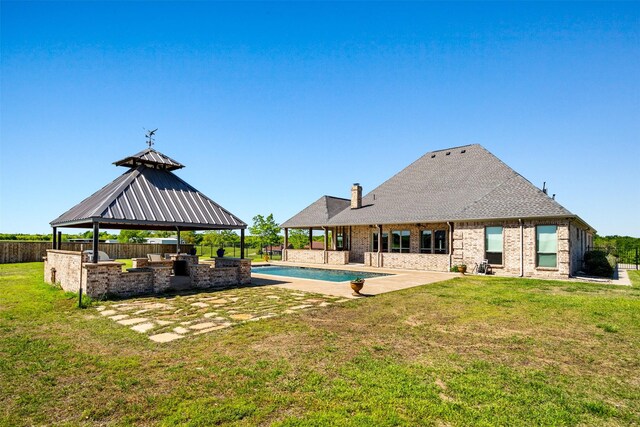 view of pool featuring a gazebo, area for grilling, a patio, and a lawn