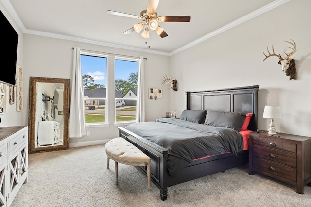 carpeted bedroom featuring ornamental molding and ceiling fan