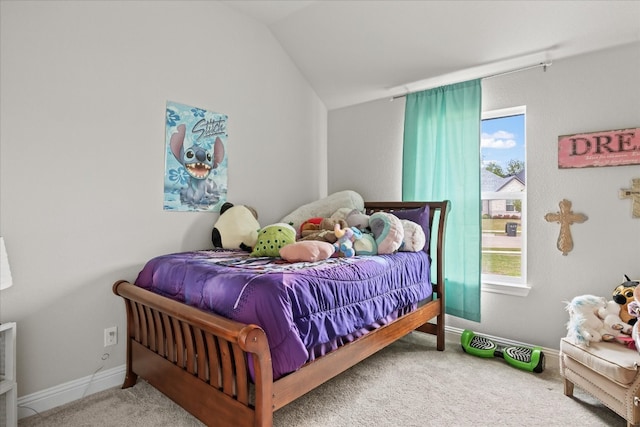 carpeted bedroom featuring vaulted ceiling