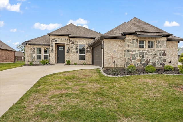 french country inspired facade featuring a garage and a front yard