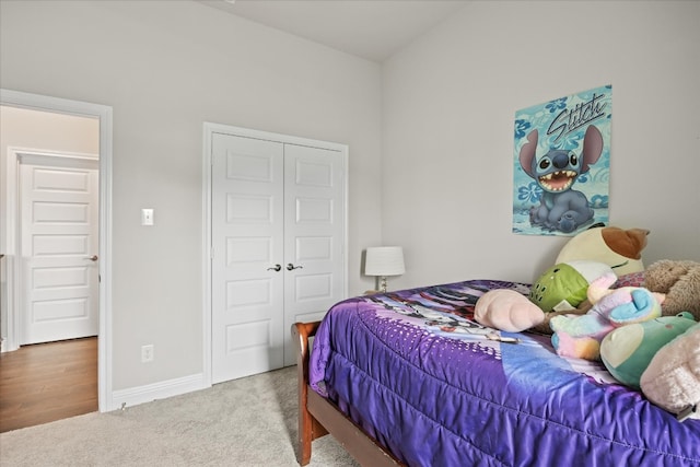 carpeted bedroom with a closet