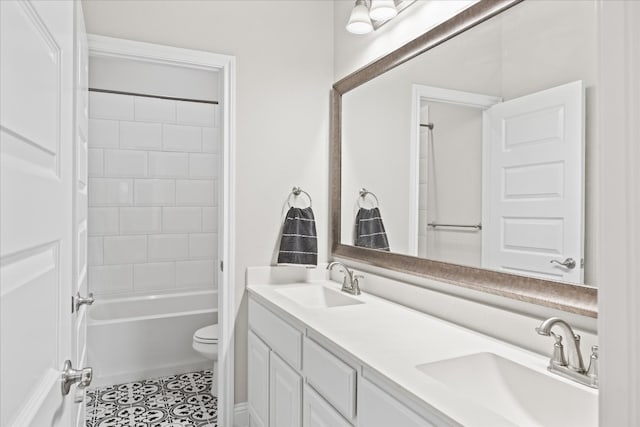 full bathroom featuring tile flooring, double vanity, tub / shower combination, and toilet