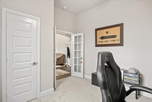 home office featuring french doors and light colored carpet