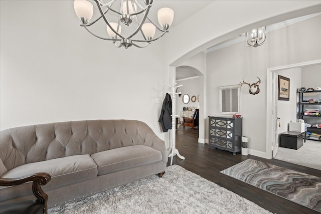 living room featuring dark hardwood / wood-style floors and a notable chandelier