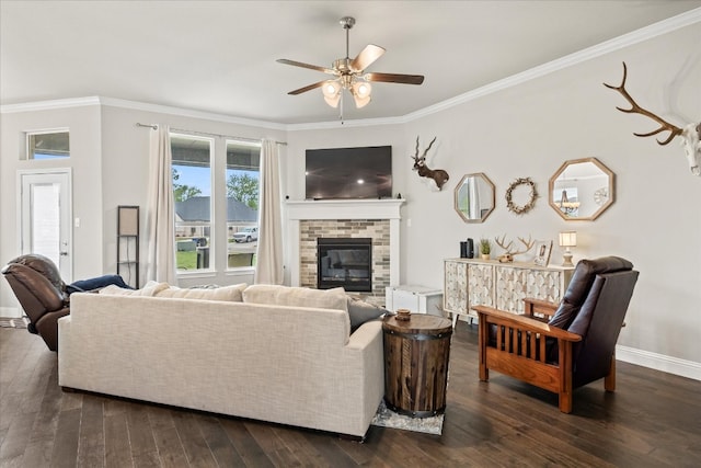 living room with crown molding, a fireplace, and dark hardwood / wood-style floors