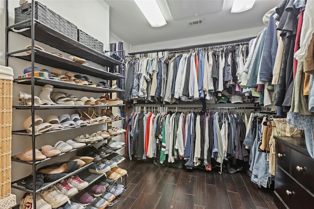 walk in closet featuring dark wood-type flooring